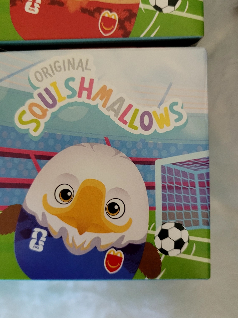Squishmallows White, Blue, Yellow Soccer Eagle Plush Box Art